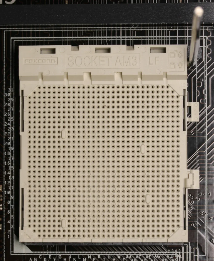 How to install a CPU: an empty motherboard socket with the retention lever lifted open